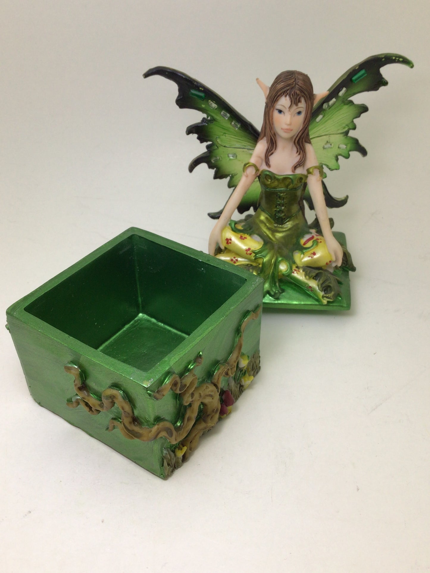 Green Fairy Sitting on Square Box