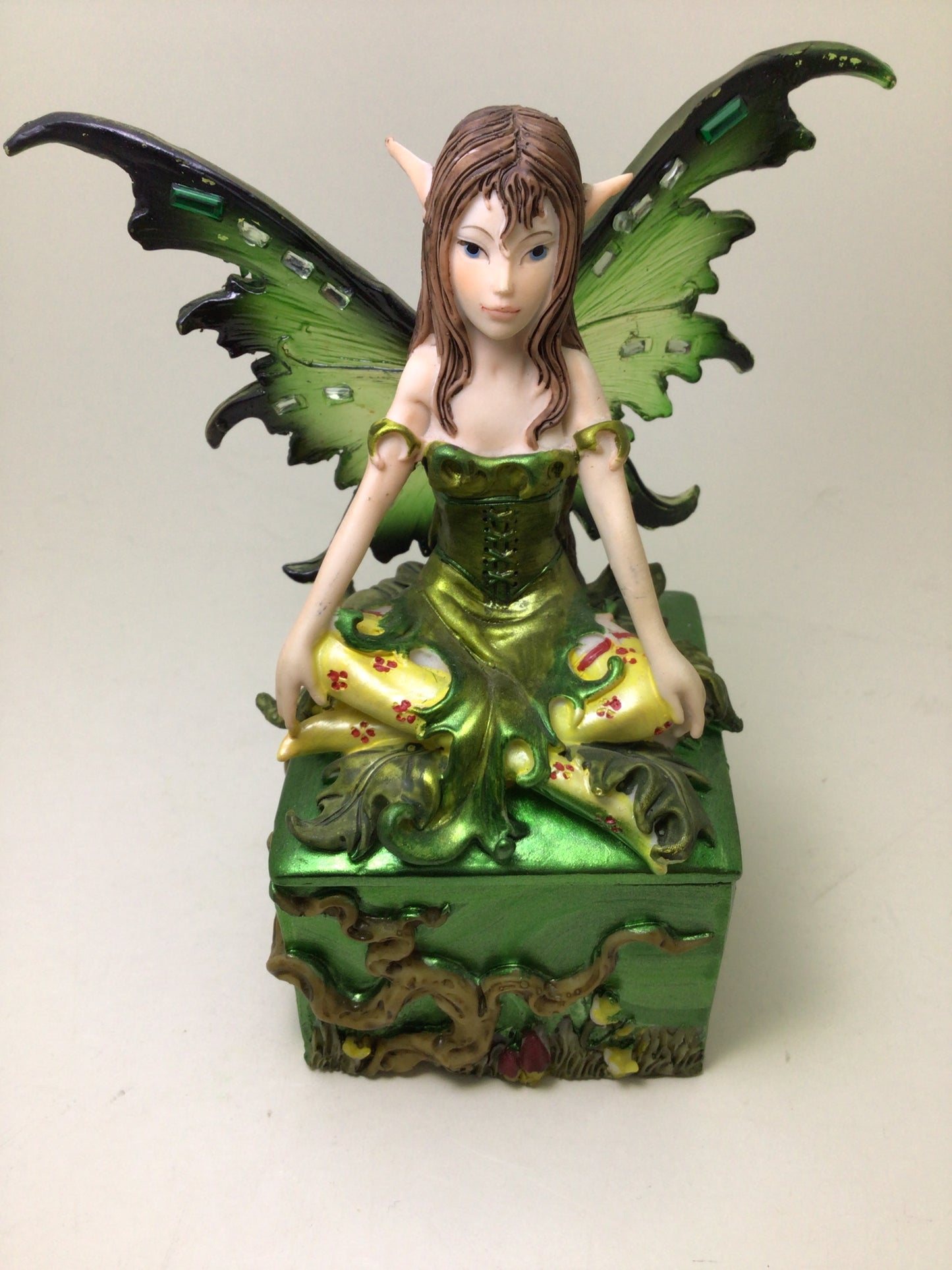 Green Fairy Sitting on Square Box