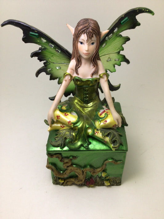 Green Fairy Sitting on Square Box